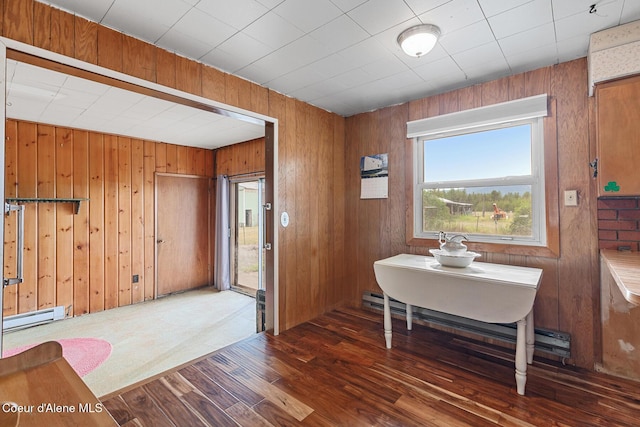 17871 N Ramsey Rd, Rathdrum, ID 83858 - dining area featuring wood finished floors, baseboard heating, and wooden walls