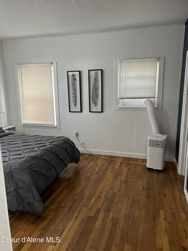 712 E Coeur D Alene Ave, Coeur Dalene, ID 83814 - bedroom with baseboards and hardwood / wood-style floors