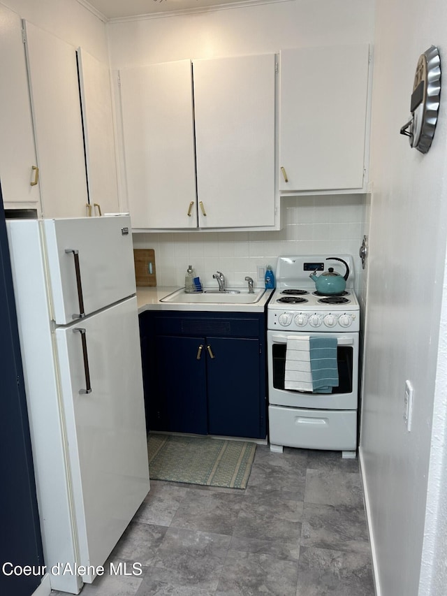 712 E Coeur D Alene Ave, Coeur Dalene, ID 83814 - kitchen with a sink, white cabinetry, white appliances, light countertops, and decorative backsplash