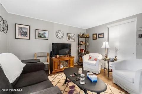 712 E Coeur D Alene Ave, Coeur Dalene, ID 83814 - living area featuring light wood finished floors