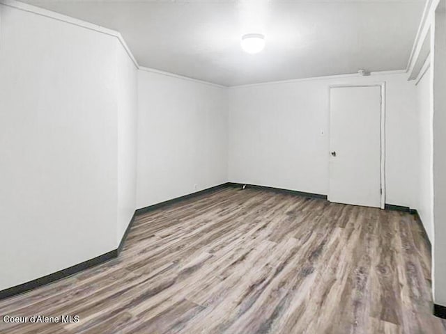 1422 E Young Ave, Coeur Dalene, ID 83814 - spare room featuring wood finished floors and ornamental molding