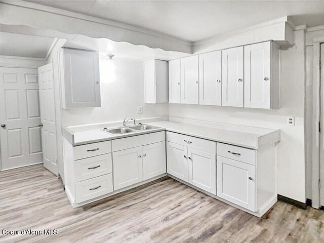 1422 E Young Ave, Coeur Dalene, ID 83814 - bathroom with a sink, crown molding, and wood finished floors