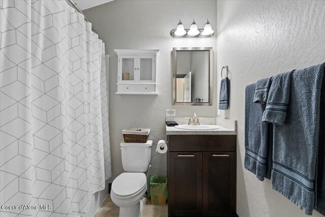 1755 W Bellerive Ln, Coeur Dalene, ID 83814 - full bathroom featuring vanity, a textured wall, curtained shower, and toilet