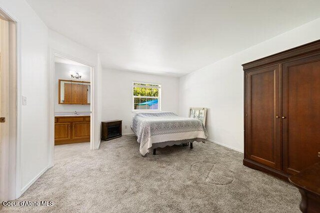 1547 E Stratford Dr, Hayden, ID 83835 - bedroom with baseboards and light colored carpet