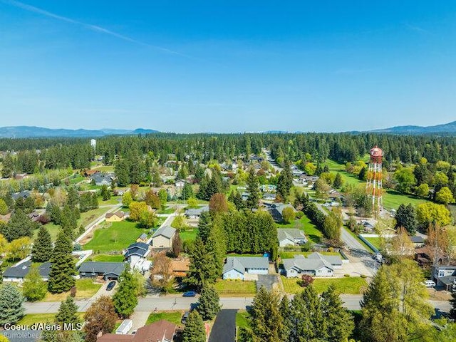 1547 E Stratford Dr, Hayden, ID 83835 - drone / aerial view with a wooded view, a mountain view, and a residential view