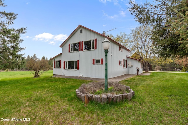 view of property exterior featuring a yard