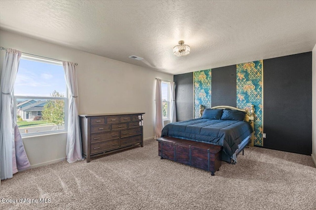 2097 W Calawah Ave, Post Falls, ID 83854 - carpeted bedroom featuring a textured ceiling and baseboards