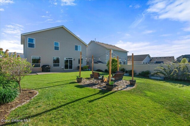 2097 W Calawah Ave, Post Falls, ID 83854 - back of property featuring a patio area