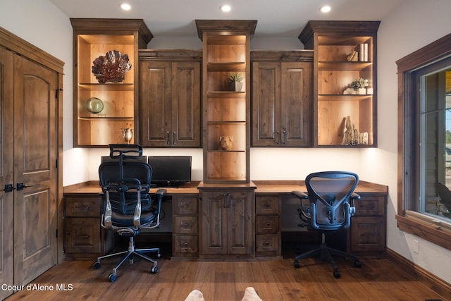 11671 N Spiraea Ln, Hayden, ID 83835 - home office featuring built in study area, dark wood-type flooring, recessed lighting, and baseboards