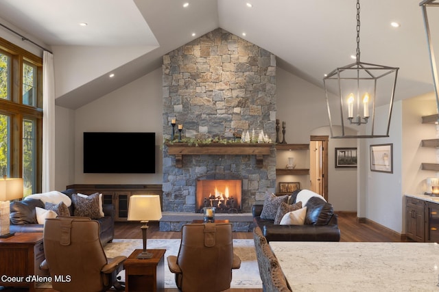11671 N Spiraea Ln, Hayden, ID 83835 - living room with wood finished floors, high vaulted ceiling, baseboards, recessed lighting, and a chandelier
