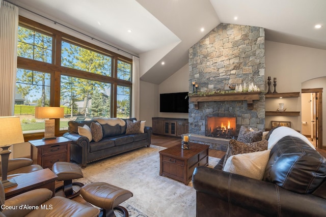11671 N Spiraea Ln, Hayden, ID 83835 - living area with wood finished floors, high vaulted ceiling, a fireplace, and recessed lighting