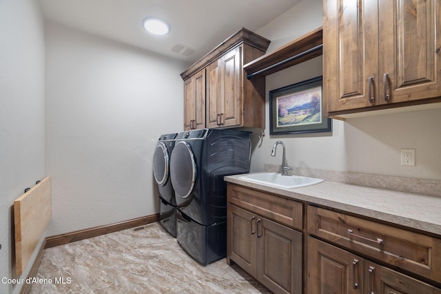 11671 N Spiraea Ln, Hayden, ID 83835 - laundry area featuring cabinet space, washer and dryer, and baseboards
