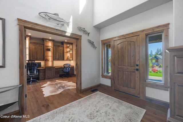 11671 N Spiraea Ln, Hayden, ID 83835 - foyer entrance featuring dark wood-style floors, healthy amount of natural light, and built in desk