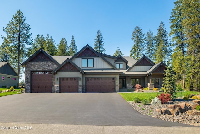 11671 N Spiraea Ln, Hayden, ID 83835 - craftsman-style house featuring stone siding, driveway, and board and batten siding