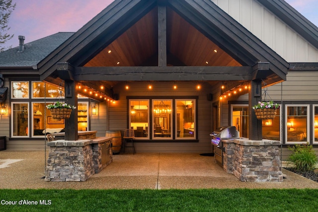 11671 N Spiraea Ln, Hayden, ID 83835 - back of house with area for grilling and a patio area