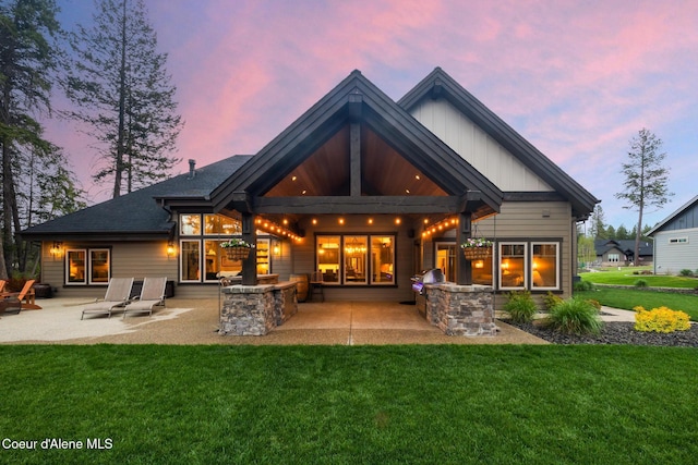 11671 N Spiraea Ln, Hayden, ID 83835 - back of house with a patio area and a yard