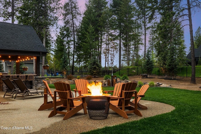 11671 N Spiraea Ln, Hayden, ID 83835 - view of patio / terrace with an outdoor fire pit