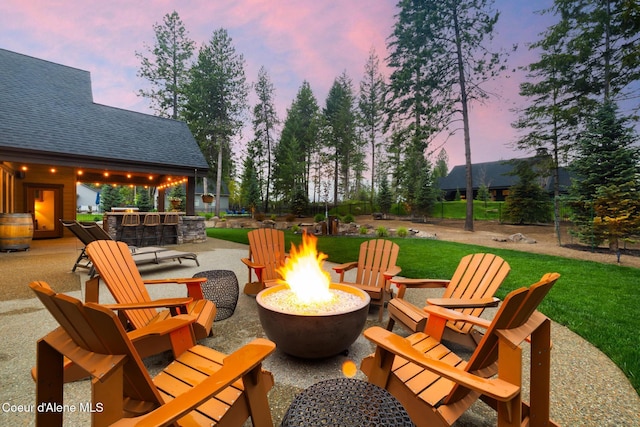 11671 N Spiraea Ln, Hayden, ID 83835 - view of patio featuring a fire pit