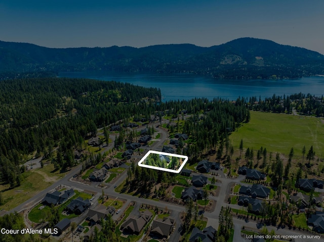 11671 N Spiraea Ln, Hayden, ID 83835 - view of property location featuring property boundaries highlighted, a water and mountain view, a forest, and nearby suburban area