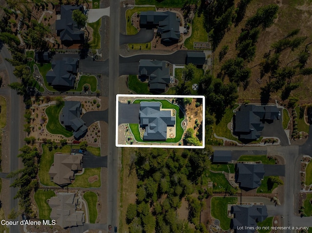 11671 N Spiraea Ln, Hayden, ID 83835 - aerial view of property and surrounding area with property parcel outlined and nearby suburban area