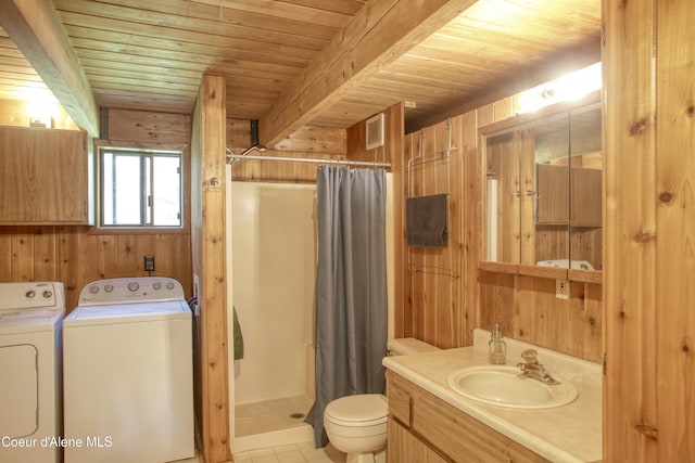 31582 E Hayden Lake Rd, Hayden, ID 83835 - full bath featuring washing machine and dryer, wood walls, a stall shower, and toilet