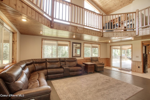 31582 E Hayden Lake Rd, Hayden, ID 83835 - living area with lofted ceiling, wood walls, a wainscoted wall, recessed lighting, and wood ceiling