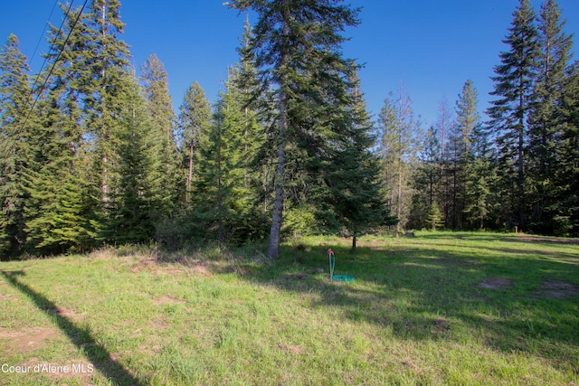 31582 E Hayden Lake Rd, Hayden, ID 83835 - view of yard featuring a wooded view