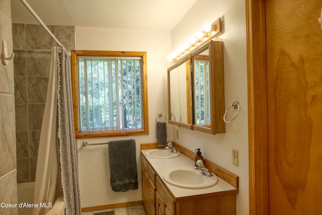 31582 E Hayden Lake Rd, Hayden, ID 83835 - full bath with a sink, double vanity, visible vents, and shower / bath combination with curtain