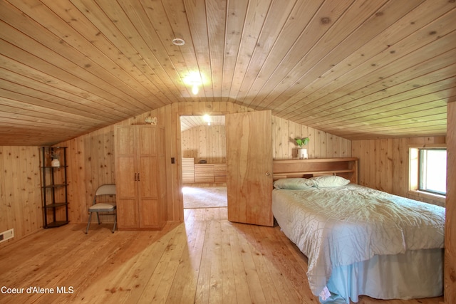 31582 E Hayden Lake Rd, Hayden, ID 83835 - bedroom featuring wooden ceiling, vaulted ceiling, wooden walls, and hardwood / wood-style floors