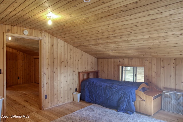 31582 E Hayden Lake Rd, Hayden, ID 83835 - bedroom featuring wood-type flooring, lofted ceiling, wood ceiling, and wooden walls