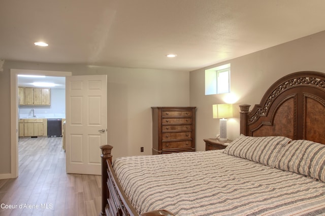 31582 E Hayden Lake Rd, Hayden, ID 83835 - bedroom featuring light wood finished floors, a sink, and recessed lighting