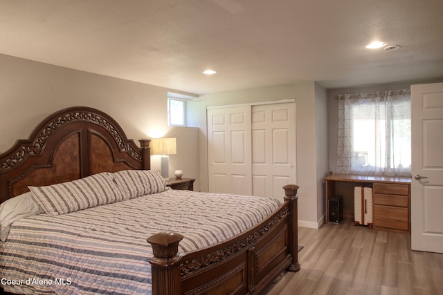 31582 E Hayden Lake Rd, Hayden, ID 83835 - bedroom with baseboards, a closet, light wood-style flooring, and recessed lighting