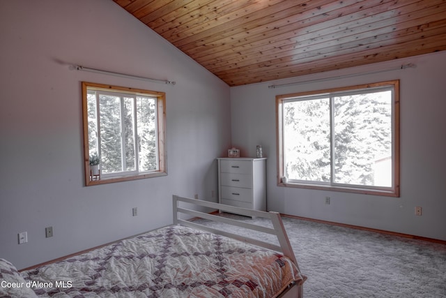 31582 E Hayden Lake Rd, Hayden, ID 83835 - carpeted bedroom with multiple windows, vaulted ceiling, and baseboards