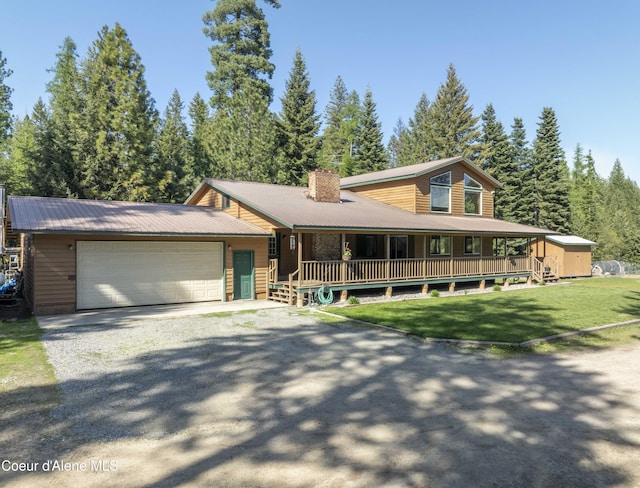 31582 E Hayden Lake Rd, Hayden, ID 83835 - farmhouse with a porch, an attached garage, driveway, a front lawn, and a chimney