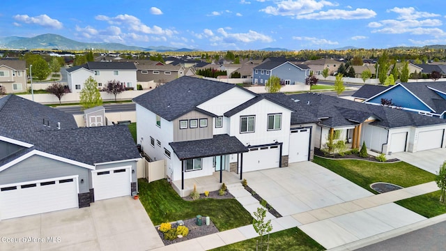 2878 N Callary St, Post Falls, ID 83854 - view of front of home with concrete driveway, a residential view, and stone siding