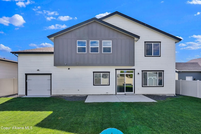 2878 N Callary St, Post Falls, ID 83854 - rear view of house featuring a lawn, fence, and board and batten siding
