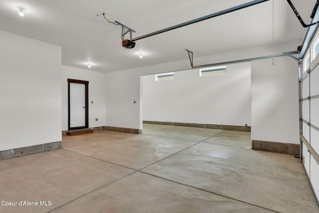2878 N Callary St, Post Falls, ID 83854 - garage with baseboards and a garage door opener