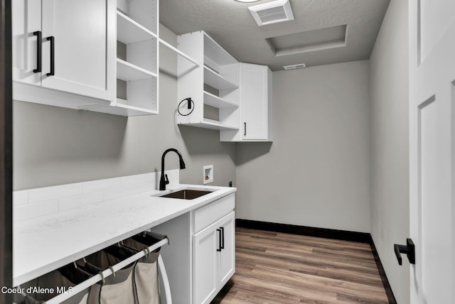 2878 N Callary St, Post Falls, ID 83854 - laundry room with a sink, hookup for an electric dryer, attic access, visible vents, and hookup for a washing machine
