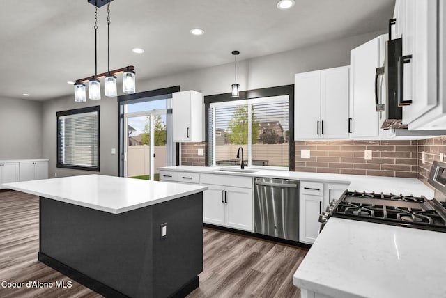 2878 N Callary St, Post Falls, ID 83854 - kitchen with a sink, backsplash, light countertops, appliances with stainless steel finishes, and recessed lighting