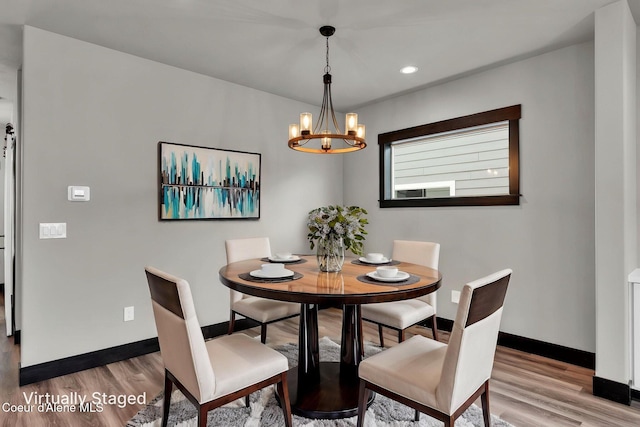 2878 N Callary St, Post Falls, ID 83854 - dining area with light wood-type flooring, a chandelier, baseboards, and recessed lighting