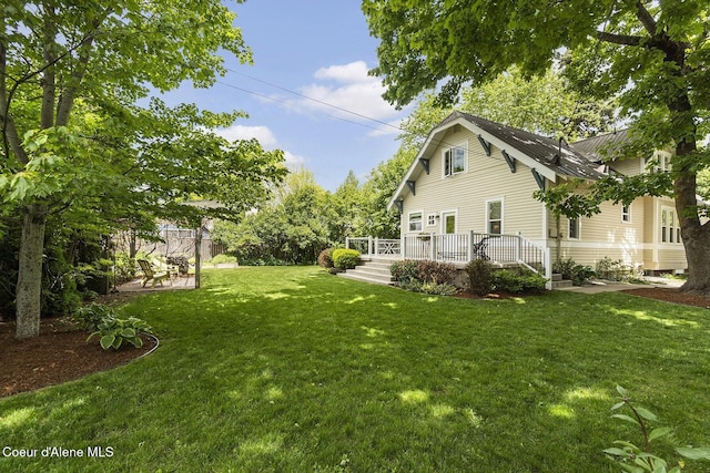 306 S Huron Ave, Sandpoint, ID 83864 - view of yard featuring a deck and fence