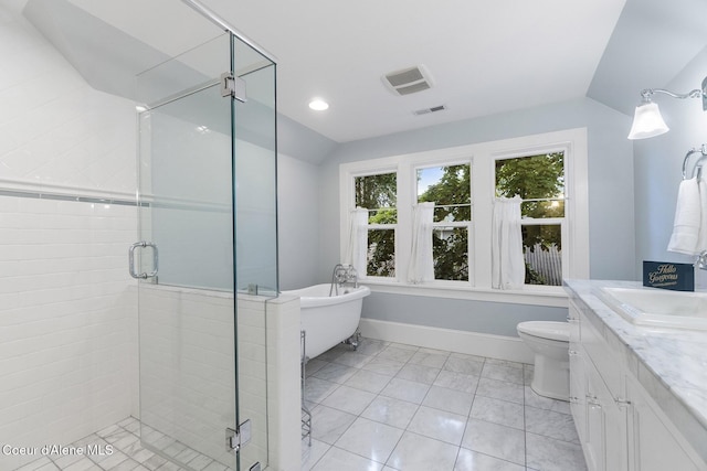 306 S Huron Ave, Sandpoint, ID 83864 - bathroom with a stall shower, a freestanding bath, visible vents, lofted ceiling, and vanity