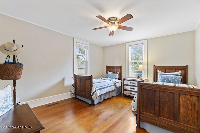 306 S Huron Ave, Sandpoint, ID 83864 - bedroom with light wood-style flooring, baseboards, a ceiling fan, and visible vents