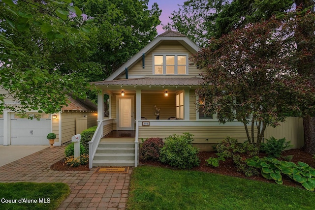 306 S Huron Ave, Sandpoint, ID 83864 - bungalow-style home with covered porch, a garage, and driveway
