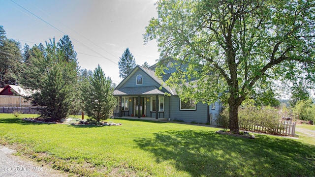 6616 Comanche St, Bonners Ferry, ID 83805 - view of front of property with a front lawn, a porch, and fence
