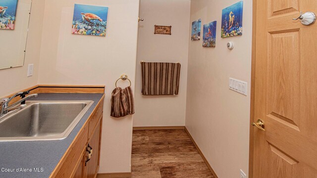 6616 Comanche St, Bonners Ferry, ID 83805 - interior space featuring vanity, baseboards, and wood finished floors