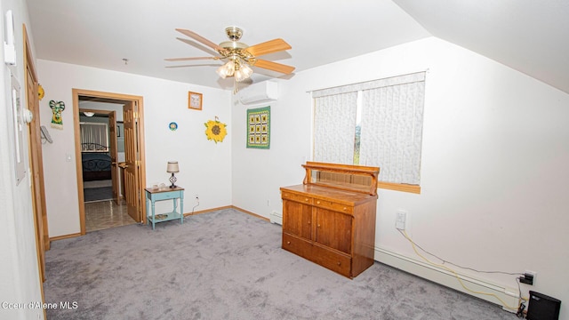 6616 Comanche St, Bonners Ferry, ID 83805 - carpeted bedroom with baseboards, baseboard heating, a ceiling fan, and a wall mounted air conditioner