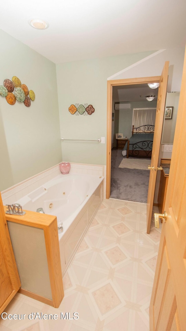 6616 Comanche St, Bonners Ferry, ID 83805 - ensuite bathroom featuring a tub with jets, a wall mounted air conditioner, connected bathroom, and tile patterned floors