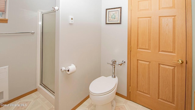 6616 Comanche St, Bonners Ferry, ID 83805 - bathroom featuring a shower stall, tile patterned floors, and toilet