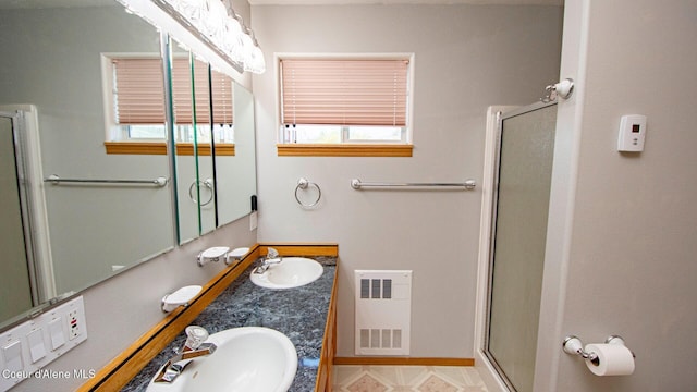 6616 Comanche St, Bonners Ferry, ID 83805 - full bath featuring a sink, a wealth of natural light, and a stall shower